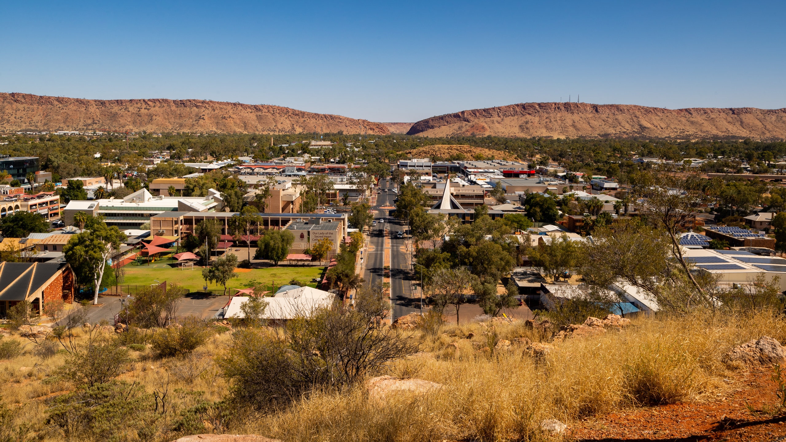 Aerial view of Alice Springs, Australia, showcasing the vibrant red desert landscape